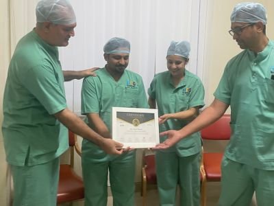 Dr. Sumit Bansal Receiving appreciation certificate